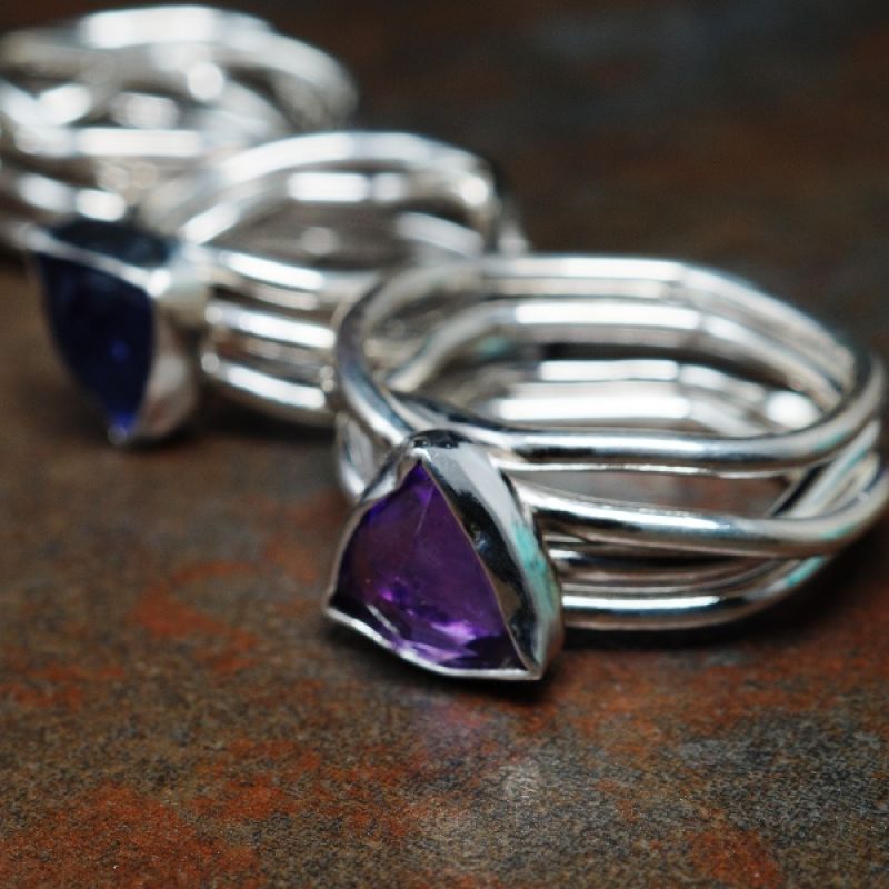 Handcrafted rings that embody the numerical ethos of the numbers 3. 6 and 9, with the trillion stones, hexagonal ring shank, combing to 9
